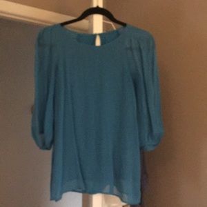 Blue, puffy sleeved top